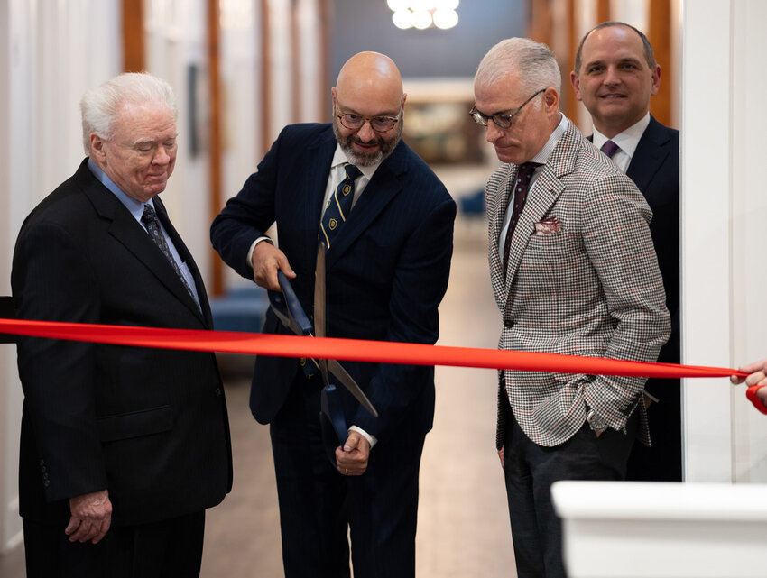 Truett McConnell University President Emir Caner cuts the ribbon at the dedication of the Charles Stanley Global Impact Center. Paige Patterson. left, In Touch President and CEO Phillip Bowen, and Anthony George, right, look on. (Photo/Truett McConnell University)