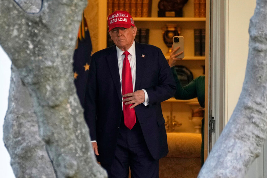 President Donald Trump walks from the Oval Office to depart on Marine One in Washington, Feb. 28, 2025. (AP Photo/Ben Curtis, File)
