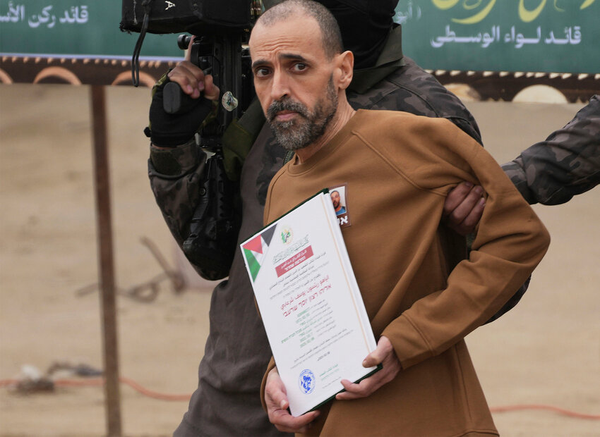 Israeli captive Eli Sharabi, who had been held hostage by Hamas terrorists in Gaza since Oct. 7, 2023, before being handed over to the Red Cross in Deir al-Balah, central Gaza Strip, Feb. 8, 2025. (AP Photo)