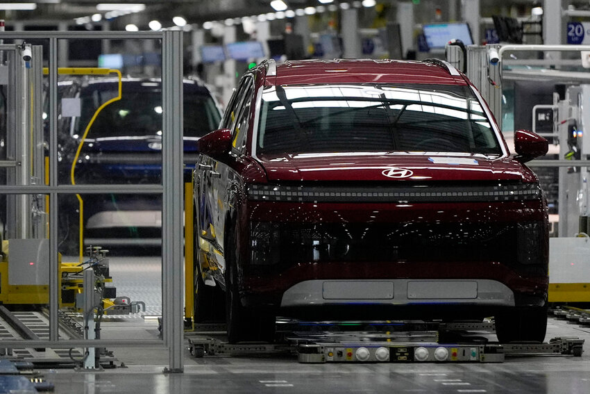 Vehicles move on the line during a media tour at the Hyundai Motor Group Metaplant America, Wednesday, March 26, 2025, in Ellabell, Ga. (AP Photo/Mike Stewart)