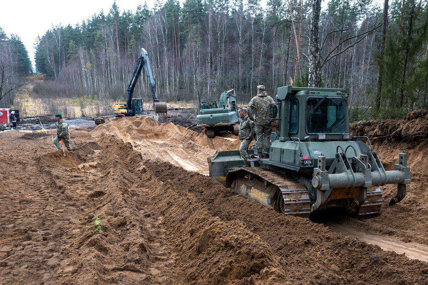 Recovery efforts continue for four missing U.S. soldiers near the spot where their Hercules armored vehicle was found submerged at a training range in Pabrade, north of the capital Vilnius, Lithuania on Thursday, March 27, 2025. (AP Photo/Mindaugas Kulbis)