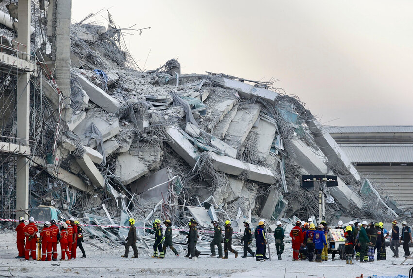 Rescuers work at the site a high-rise building under construction that collapsed after a 7.7 magnitude earthquake in Bangkok, Thailand, Friday, March 28, 2025. (AP Photo/Wason Wanichakorn)