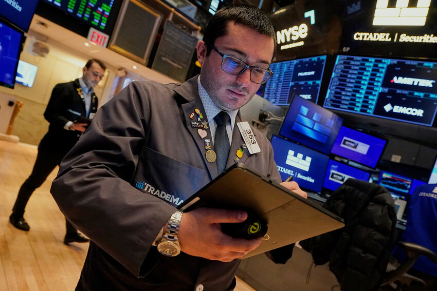 Trader Drew Cohen works on the floor of the New York Stock Exchange, Monday, April 14, 2025. (AP Photo/Richard Drew)