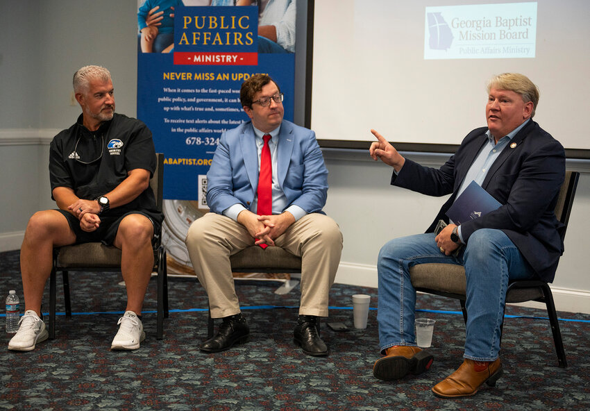 Brad Hughes, chairman of the Georgia Baptist Mission Board's Public Affairs Committee and director of Field Services for Georgia Gov. Brian Kemp, speaks during a panel discussion with former State Rep. Kevin Cooke and former State Sen. Josh McKoon, center, at a training session at Shorter University in August 2024. (Index/Henry Durand, File)