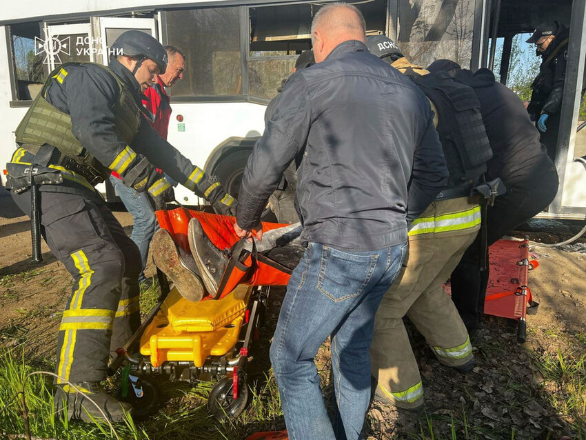 Rescuers remove victims after a Russian drone hit a public bus in Marhanets, Dnipropetrovsk region, on Wednesday, April 23, 2025. (Ukrainian Emergency Service via AP)