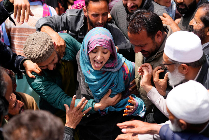A relative wails during the funeral procession of Adil Hussain Shah, a worker who was killed when militants opened fire on a crowd of mainly tourists on Tuesday, at his village Hapatnar, in Indian controlled Kashmir, Wednesday, April 23, 2025. (AP Photo/Dar Yasin)