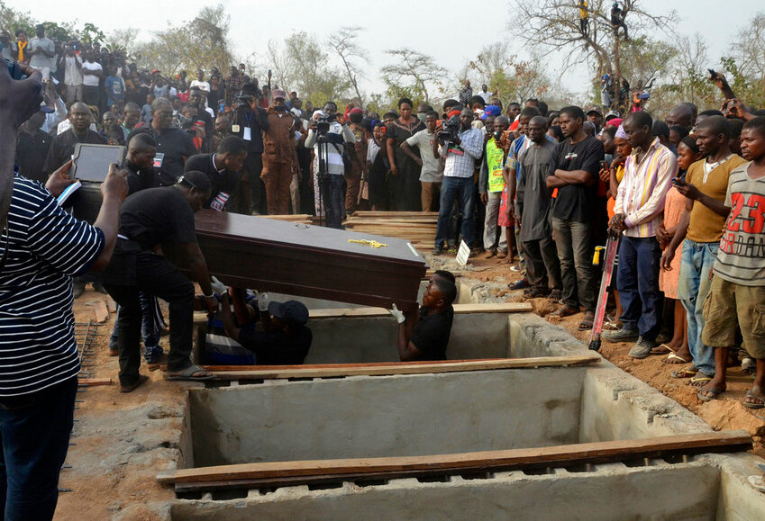 Volunteers handle coffins during a mass funeral for victims of attacks blamed on Fulani herdsmen in Makurdi, Nigeria in 2018. (AP Photo, File)
