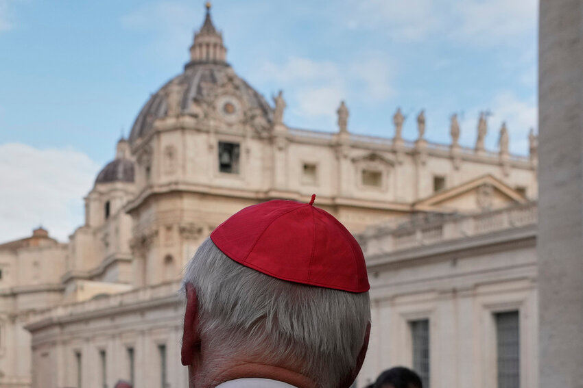 St Peter's Basilica is seen in the background as a cardinal arrives for a college of cardinals' meeting at the Vatican, Monday, April 28, 2025. (AP Photo/Gregorio Borgia)