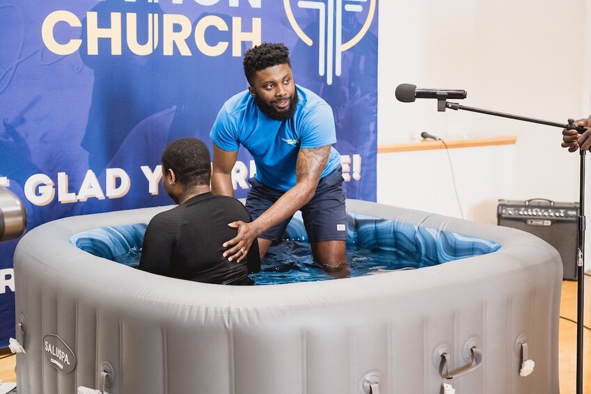 Temidayo Akinsanya, pastor of Restoration Church in Laurel, Md., conducts a baptism on Easter Sunday, 2025. (Photo/Restoration Church via Facebook)