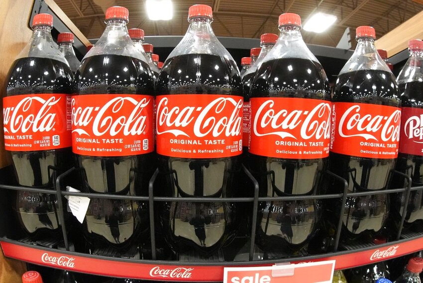 A shelf of Coca-Cola 2-liter bottles at a market in Homestead, Pa., Feb. 24, 2025. (AP Photo/Gene J. Puskar, File)
