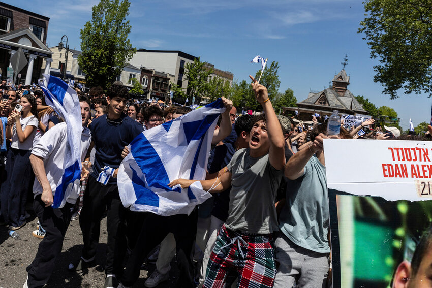 People gathered in Huyler Park celebrate the release of American hostage Edan Alexander by Hamas terrorists on Monday, May 12, 2025, in Tenafly, N.J. (AP Photo/Stefan Jeremiah)