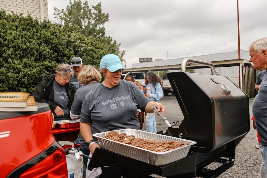 Volunteers with Send Relief’s Serve Tour stop in Evansville, Ind., on May 2-3, helped grill and distribute free hamburgers to members in the community. As they provided food, they would often engage people in conversation and share the gospel. (Send Relief/Lacey Villasenor)