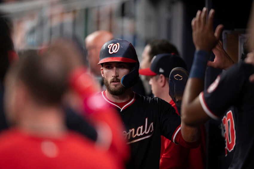 Washington Nationals' Dylan Crews celebrates with teammates after scoring in the seventh inning against the Atlanta Braves Wednesday, May 14, 2025, in Atlanta. (AP Photo/Kathryn Skeean)