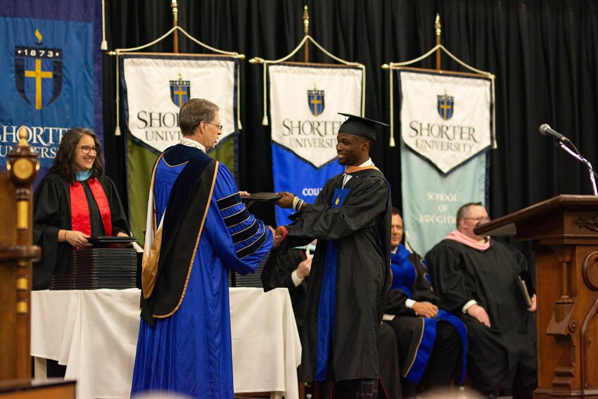 Shorter University President Don Dowless awards a student his diploma at Shorter University’s 2025 Spring Commencement. (Photo/Shorter University)