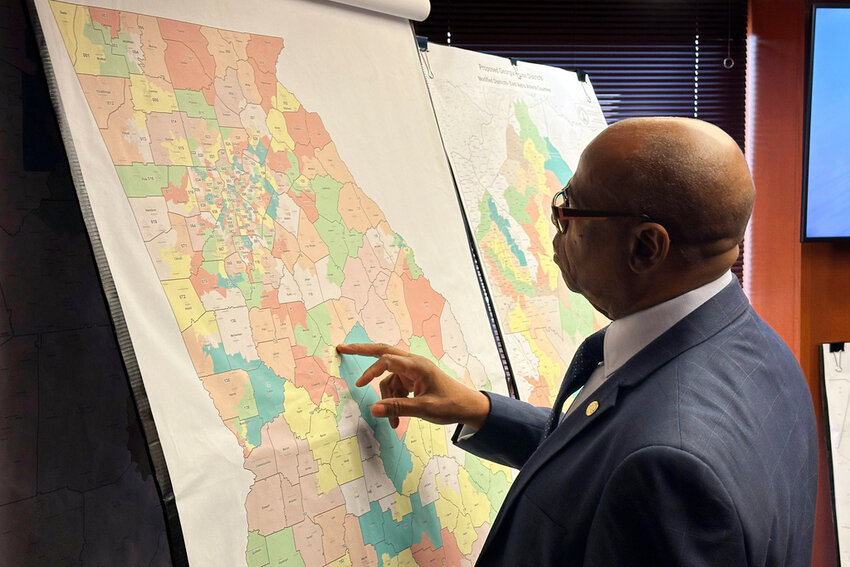 Georgia state Rep. Mack Jackson, D-Sandersville, looks at a map of proposed state House districts before a House hearing, Nov. 29, 2023, at the Georgia Capitol in Atlanta. (AP Photo/Jeff Amy, File)