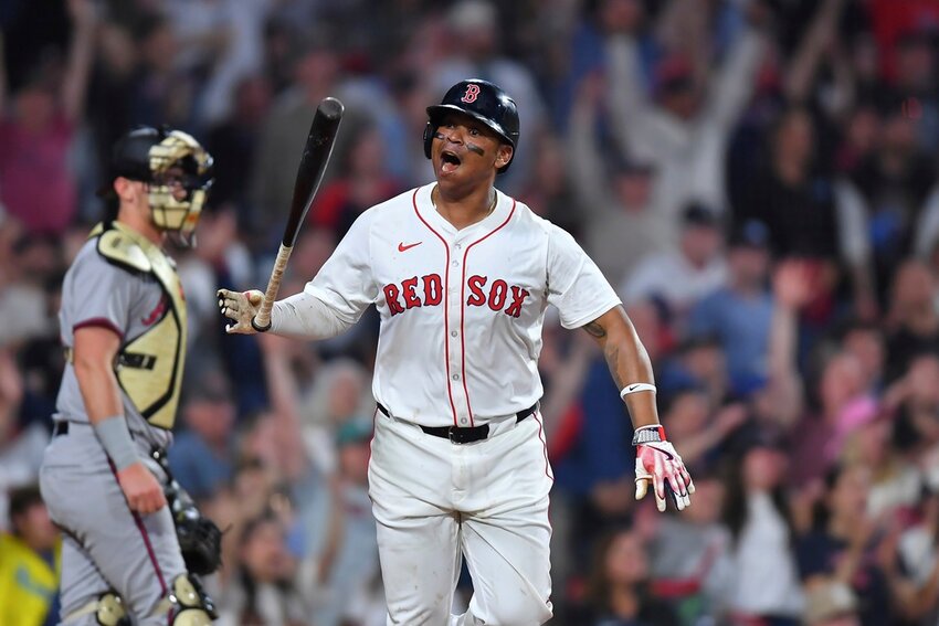Boston Red Sox's Rafael Devers, right, starts to run the bases after hitting a walkoff home run in the ninth inning against the Atlanta Braves, Saturday, May 17, 2025, in Boston. (AP Photo/Steven Senne)