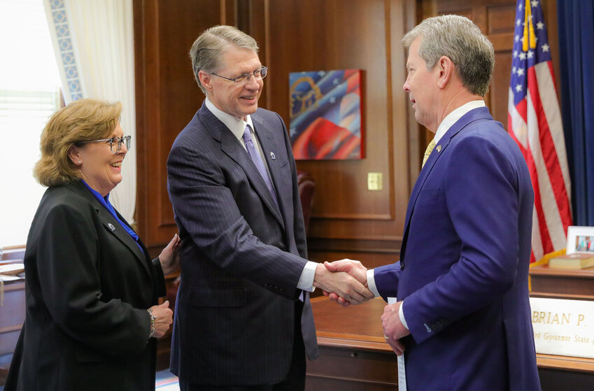 Dr. Don Dowless, President of Shorter University, receives congratulations from Governor Brian Kemp following his appointment to the Georgia Nonpublic Postsecondary Education Commission. His wife, Teresa, joined him for the April 27, 2025, ceremony at the Georgia State Capitol. (Photo/Office of Governor Brian P. Kemp)