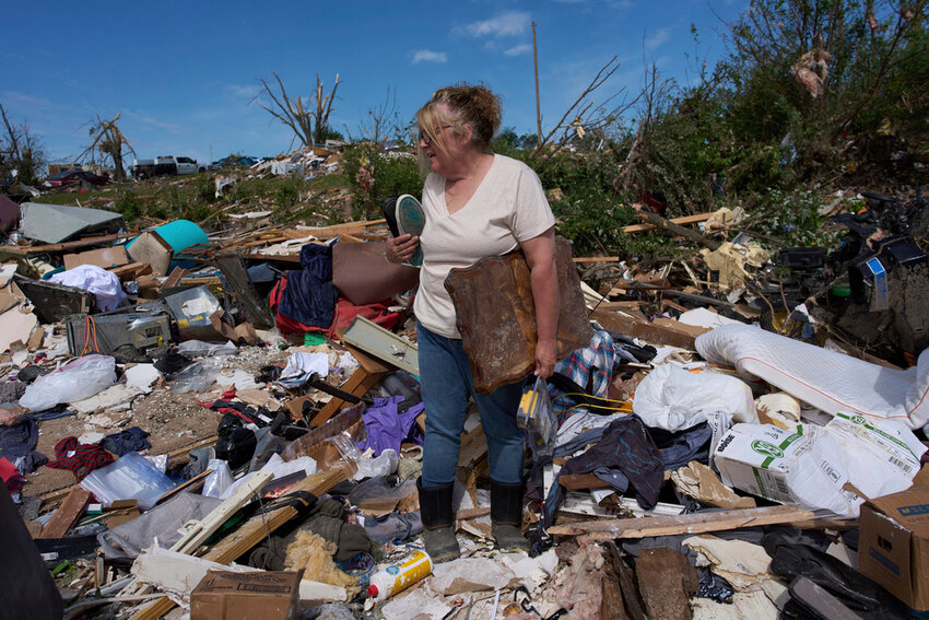 Edwina Wilson stands in what is left of her destroyed home, Sunday, May 18, 2025, in London, Ky., after a severe storm passed through the area. (AP Photo/Carolyn Kaster)