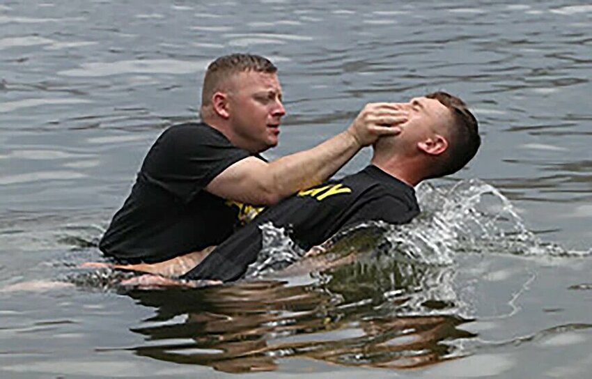 Brigade Chaplain Tyler Shields baptizes a soldier in the North Atlantic Ocean. Nine soldiers were baptized by Shields, who is concluding a 20-year career with the Army National Guard. He is the senior pastor at FBC Barbourville. (Photo/via Kentucky Today)