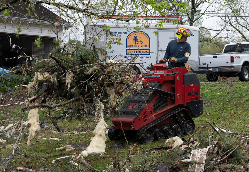 A Georgia Baptist Disaster Relief volunteer clears debris in the aftermath of a tornado that hit Conyers, Georgia, in 2024. (Index/Henry Durand. File)