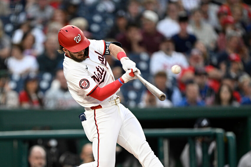 Washington Nationals' Dylan Crews hits a solo home run off Atlanta Braves pitcher Spencer Strider during the second inning in Washington, Tuesday, May 20, 2025. (AP Photo/Terrance Williams)