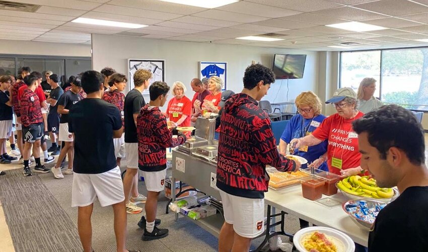 The Dallas Cup Hospitality Center received more than 2,000 visits from youth soccer players and coaches from around the world. Volunteers from several Dallas-area churches served. (Photo/Courtesy photo via The Baptist Standard)