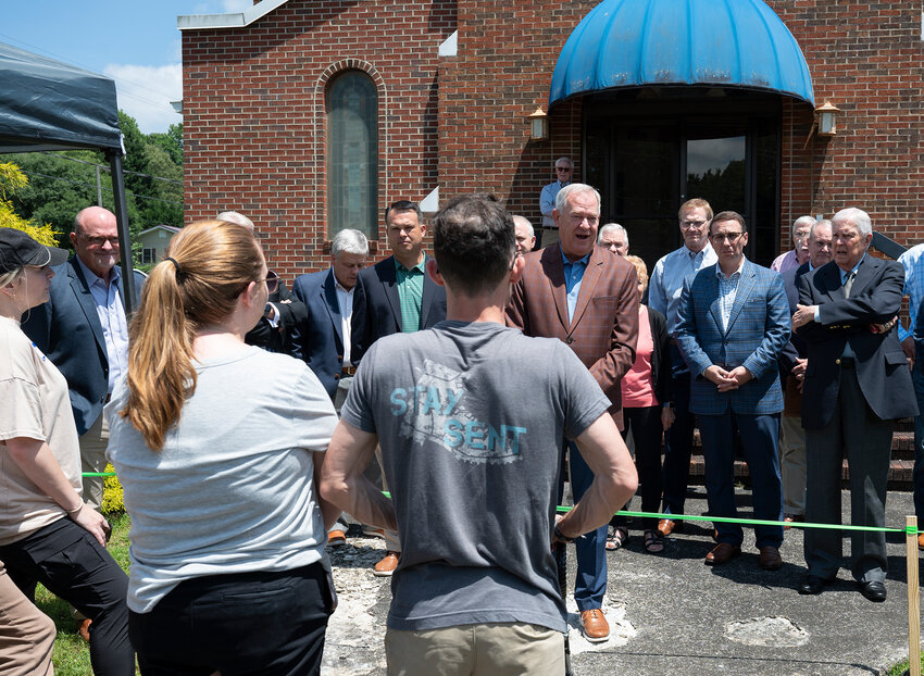 Chairman of the TMU Board of Trustees and Northside Baptist Church senior pastor Robby Foster, with the trustees behind him, addresses the group of alumni gathered outside the board meeting Friday in Cleveland. (Index/Henry Durand)