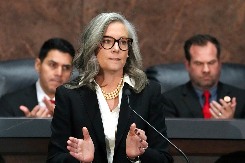 Arizona Democratic Gov. Katie Hobbs, center, gives the State of the State address in the House of Representatives at the state Capitol with Speaker of the House Rep. Steve Montenegro, R-Litchfield Park, left, and Senate President Warren Petersen, R-Gilbert, flanking the governor on Jan. 13, 2025, in Phoenix. (AP Photo/Ross D. Franklin, File)