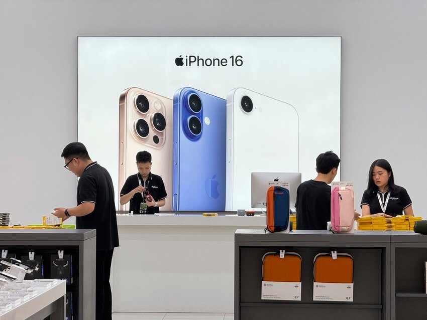 Sales staffs work at an Apple shop in Hanoi, Vietnam, April 10, 2025. (AP Photo/Hau Dinh, File)