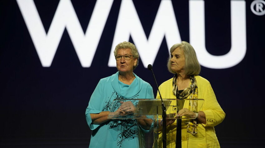 Sandra Wisdom-Martin, left, and Connie Dixon give the report for the Woman’s Missionary Union at the 2025 Southern Baptist Convention annual meeting in Dallas. (The Baptist Paper/Marc Ira Hooks)