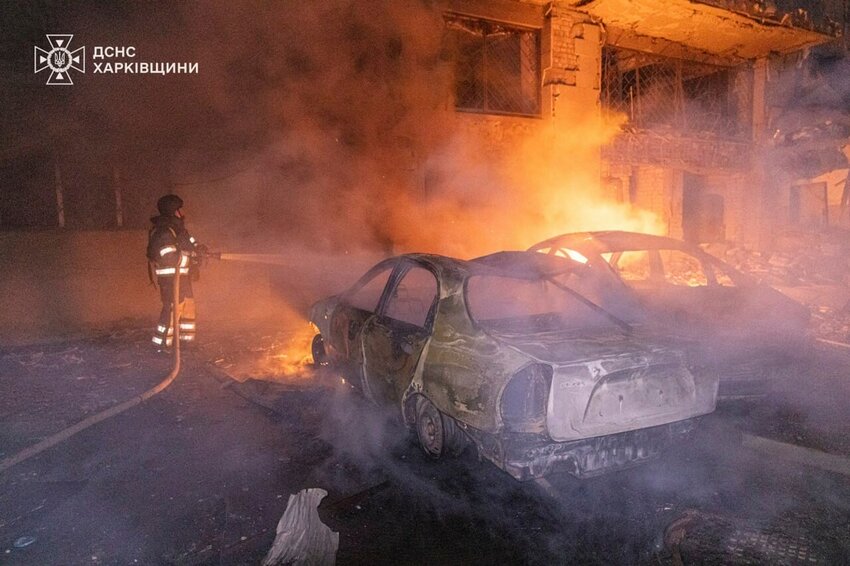 A rescue worker puts out a fire near a building which was damaged by a Russian strike in Kharkiv, Ukraine. (Ukrainian Emergency Services of Ukraine via AP)