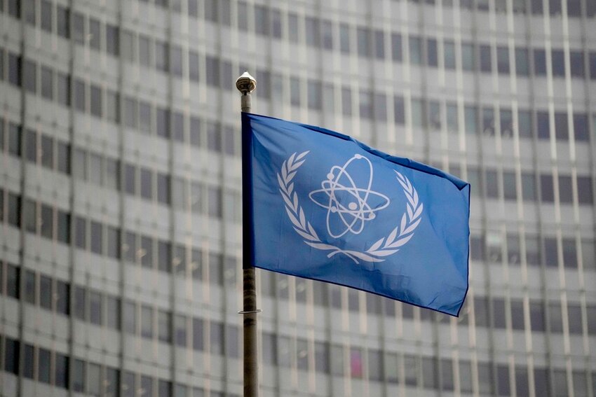 The flag of the International Atomic Energy Agency flies in front of its headquarters during an IAEA Board of Governors meeting in Vienna, Austria, Nov. 22, 2023. (AP Photo/Matthias Schrader, File)