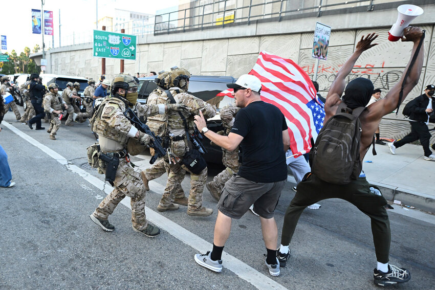 Demonstrators clash with members of US Border and Customs Protection during protests on Thursday, June 12, 2025, in Los Angeles (AP Photo/Wally Skalij)
