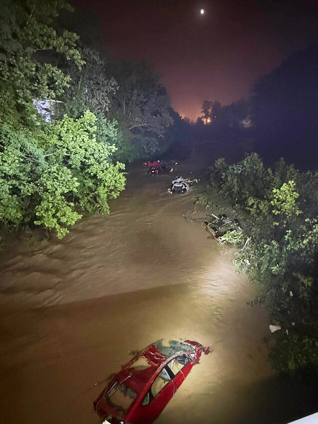 Cars are submerged in floodwaters, Saturday, June 14, 2025, in Wheeling, W.V. (Wheeling West Virginia Fire Department via AP)