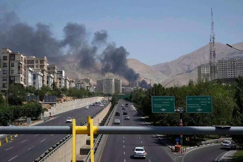 Smoke rises from an oil storage facility after it appeared to have been struck by an Israeli strike on Saturday, in Tehran, Iran, Monday, June 16, 2025. (AP Photo/Vahid Salemi)
