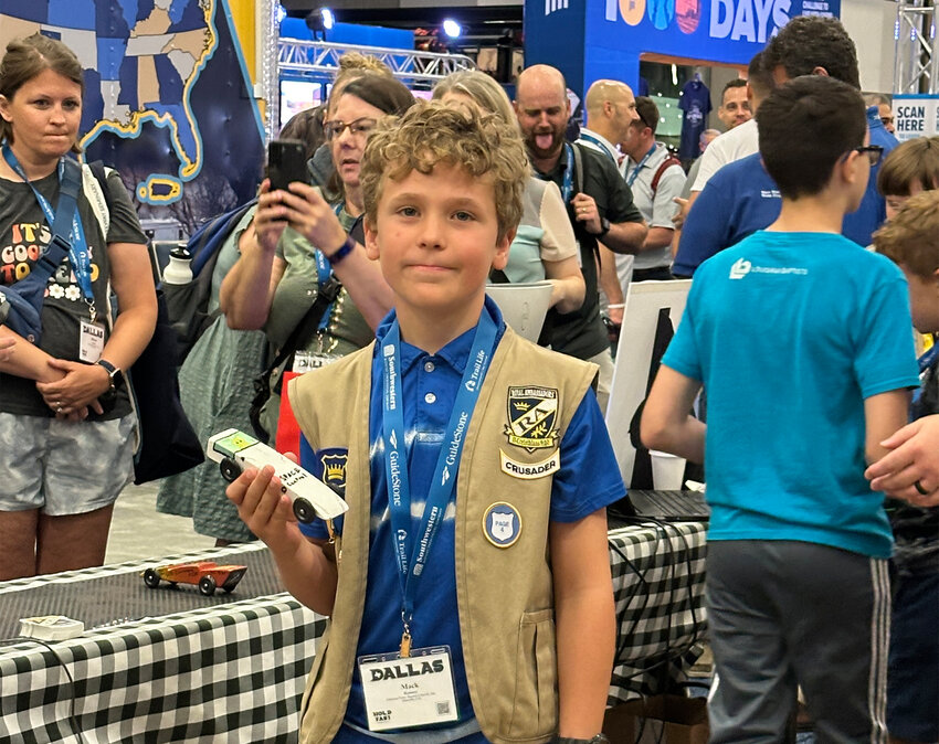 Mack Kenney poses with his car at the Royal Ambassador Pinewood Derby held June 9, just before the 2025 Southern Baptist Convention Annual Meeting in Dallas. (Index/Greg Teffertiller)