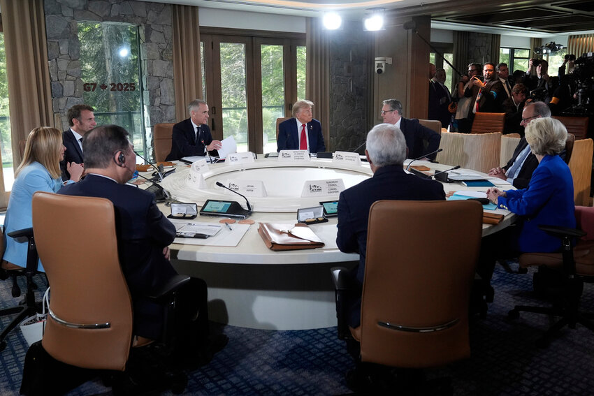 From left, Italy's Prime Minister Giorgia Meloni, France's President Emmanuel Macron, Canada's Prime Minister Mark Carney, President Donald Trump, Britain's Prime Minister Keir Starmer and Germany's Chancellor Friedrich Merz participate in a session of the G7 Summit, Monday, June 16, 2025, in Kananaskis, Canada. (AP Photo/Mark Schiefelbein)