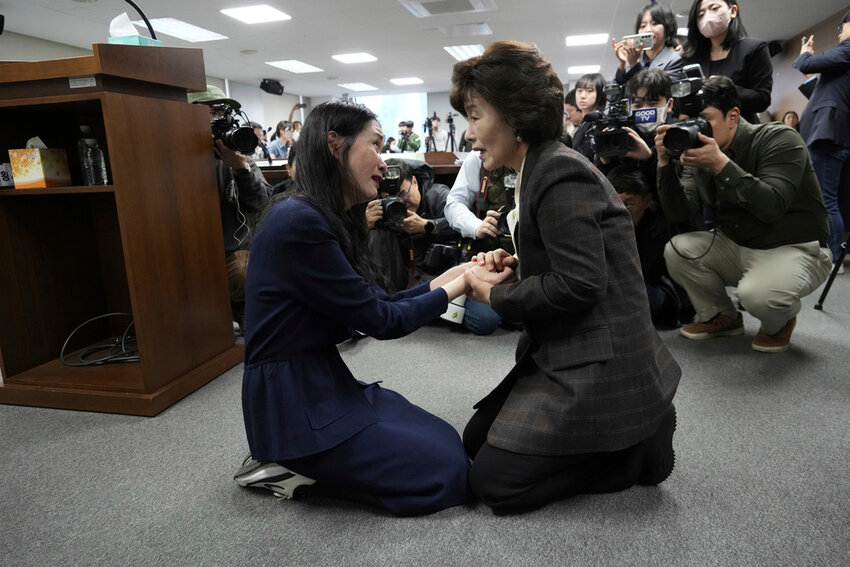 Truth and Reconciliation Commission Chairperson Park Sun Young, right, comforts adoptee Yooree Kim during a press conference in Seoul, South Korea, March 26, 2025. (AP Photo/Ahn Young-joon, File)
