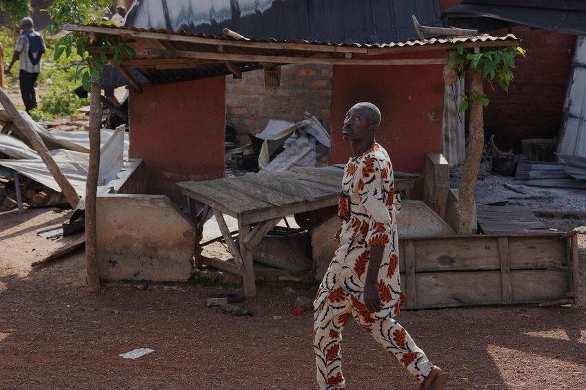 A man walks past a damaged house following an attack by gunmen in Yelewata community north-central Nigeria, Monday, June 16, 2025. (AP Photo)
