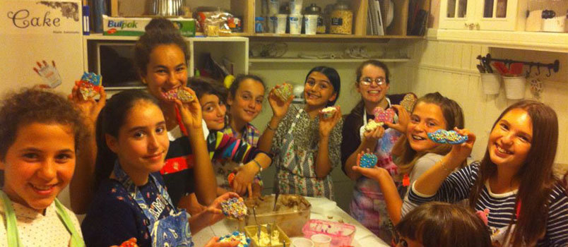Krista, in back right wearing glasses, and her baking skills came in handy in meeting with local girls for fun (and delicious) times of fellowship.