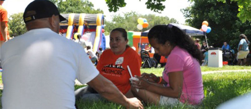 In this file photo, Patricia Beltran, of First Hispanic Baptist Church of Atlanta, shares a witness with an Hispanic family at the Community Day event. JOE WESTBURY/Index