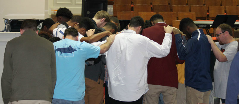Brewton-Parker College students gather for prayer during revival services. The four-day event was held in Saliba Chapel on the school's campus in Mount Vernon. MANDY CORBIN/BPC