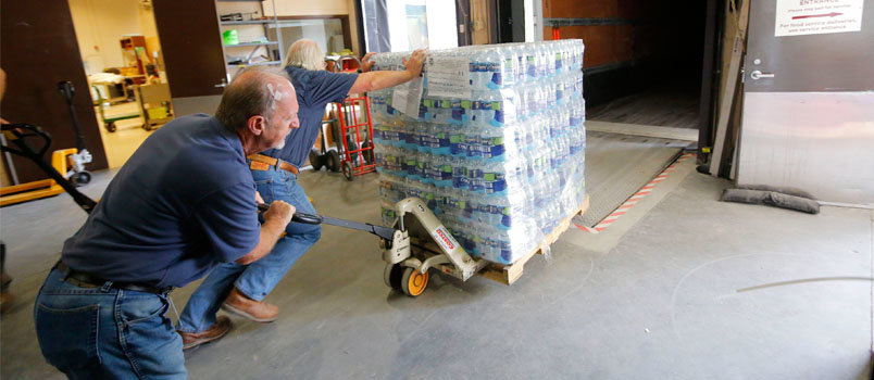 In this file photo Georgia Baptist Disaster Relief volunteers Dale Price, left, and Serge Renard, both of Cumming, load a pallet of water headed for South Carolina to aid survivors of historic flooding in the state and neighboring North Carolina. The truck unloaded at Southern Baptist Disaster Relief command centers at the South Carolina Baptist Convention office in Columbia and a North American Mission Board mobile command center at Awaken Church in Charleston. Price and Renard are both members of First Redeemer Church, Cumming. SUSAN WHITLEY/NAMB