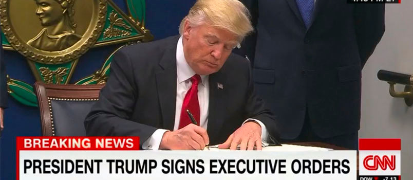 President Donald Trump signs the executive order Jan. 27 barring citizens of seven countries – Iraq, Iran, Syria, Libya, Somalia, Sudan, and Yemen – from entering the United States for at least the next 90 days. The Syrian ban is indefinite. Screen grab cnn.com