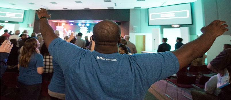 Jonathan Dimanche, hospitality pastor at Liberty Baptist Church in Hampton, VA, worships God during an International Mission Board Sending Celebration March 1. Dimanche and other Liberty members volunteered during the event, which honored new Southern Baptist missionaries. ROY BURROUGHS/IMB