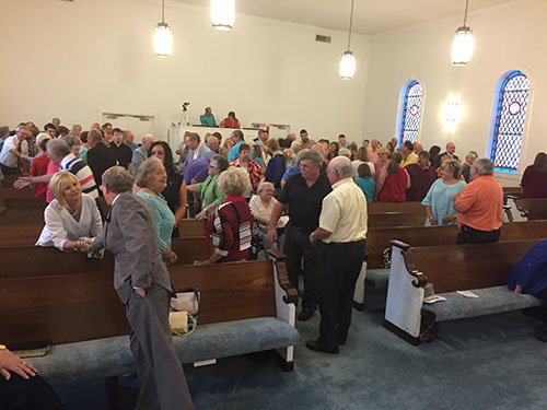 Fellowship time during homecoming service at Enon Baptist church. GERALD HARRIS/Index