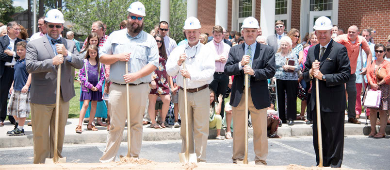 Standing left to right Robert Byington, Jr., Suthern Smith, Chuck Smith, Chase Gregory, and Pastor Robby Foster break ground for the church's new building project that will include a 1,200-seat sanctuary, glas walk-around atrium, and 92-seat choir. NBC/Special