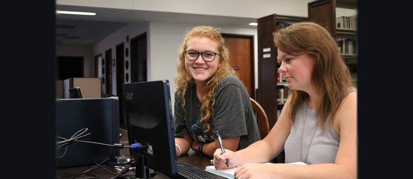 BPC students Sarah Ruck, left, and Samantha Stanford, a business major, do some work on computers in Fountain-New Library on the school's Mount Vernon campus. Brewton-Parker leadership recently announced a new fully-online degree in business, set to begin in January. MORGAN PAGE/BPC