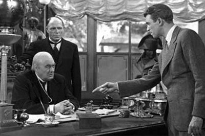 James Stewart's George Bailey, right, stares down Mr. Potter, played by Lionel Barrymore, in "It's a Wonderful Life."