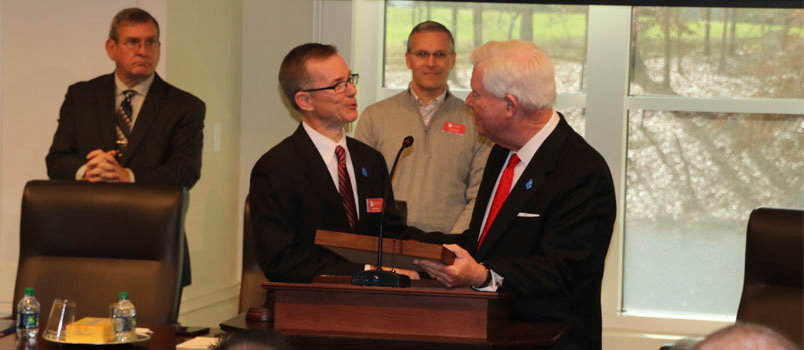 Outgoing Executive Committee chairman and current Georgia Baptist Convention President Mike Stone, left, is presented with a gavel by Georgia Baptist Executive Director J. Robert White near the close of the Executive Committee meeting Dec. 12 at the Missions and Ministry Center. Newly-elected incoming Executive Committee Chairman Andy Childs, pastor of Ebenezer Baptist Church in Toccoa, stands in the background, middle. SCOTT BARKLEY/Index